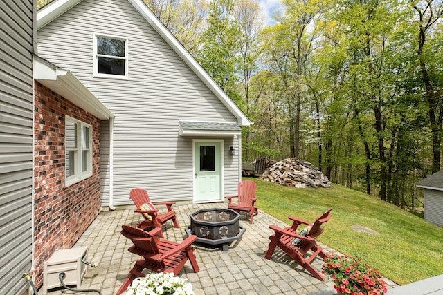 view of patio / terrace with an outdoor fire pit