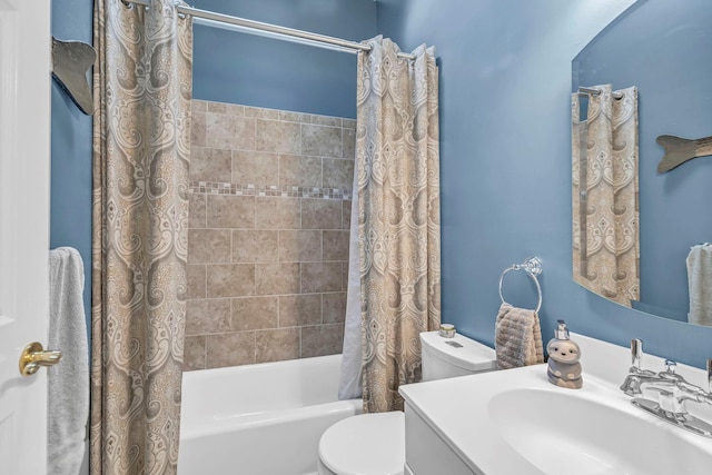 bathroom with toilet, shower / bath combo, and vanity