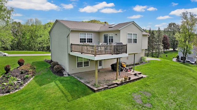 back of house featuring a patio area, a yard, and a deck