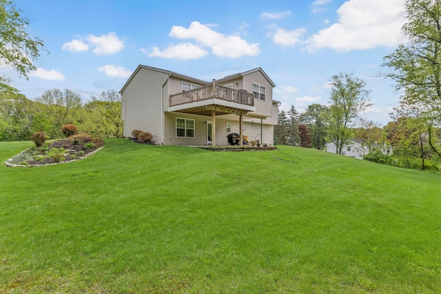 back of property featuring a deck and a yard