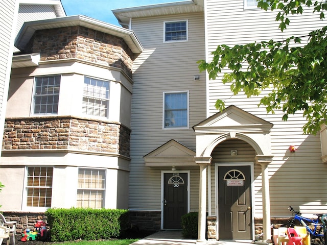 view of front facade featuring stone siding