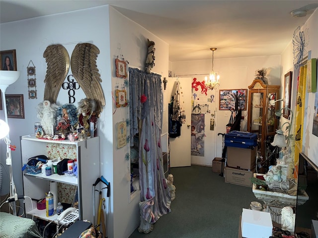 miscellaneous room with a chandelier and carpet flooring