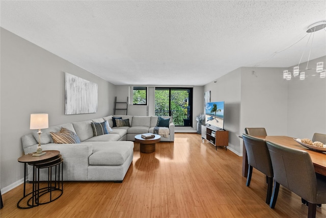 25 Rockledge Ave Unit 501, White Plains, NY 10601 - living area with a textured ceiling, baseboards, and light wood-style floors