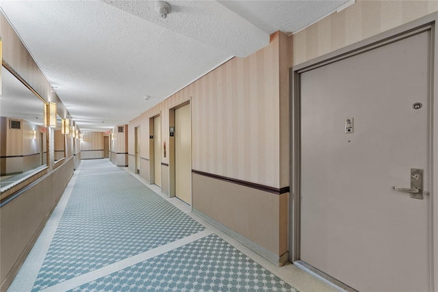 25 Rockledge Ave Unit 501, White Plains, NY 10601 - hall with a textured ceiling, baseboards, and elevator