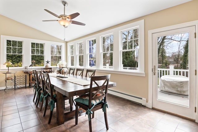 sunroom / solarium featuring baseboard heating and vaulted ceiling