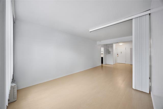142-05 Roosevelt Ave Unit 331, Flushing, NY 11354 - unfurnished living room with wood finished floors