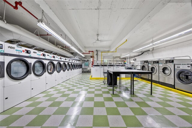 142-05 Roosevelt Ave Unit 331, Flushing, NY 11354 - community laundry room with washer and clothes dryer and tile patterned floors