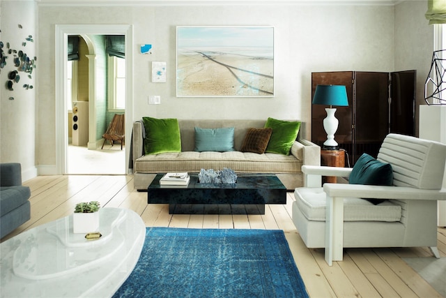 living room featuring hardwood / wood-style floors and crown molding