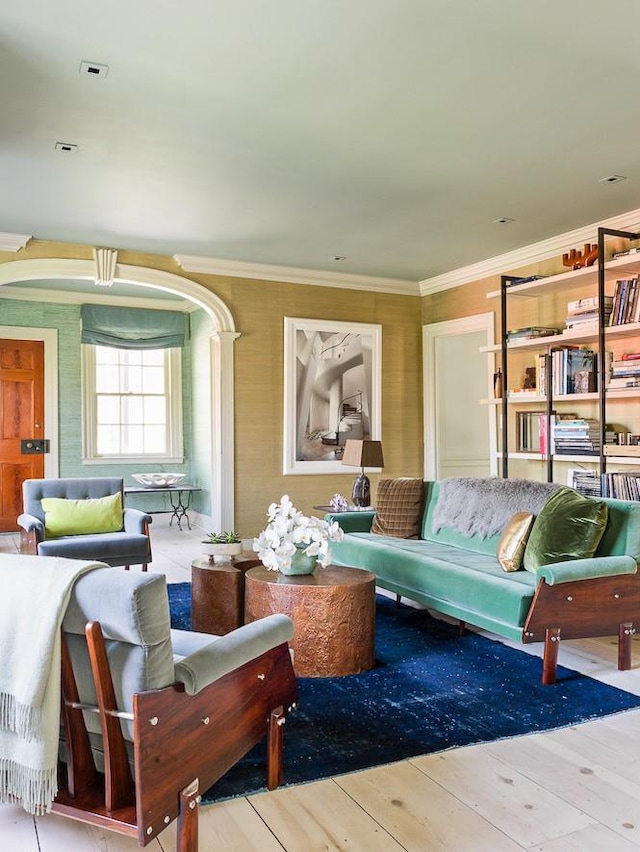 living room with ornamental molding