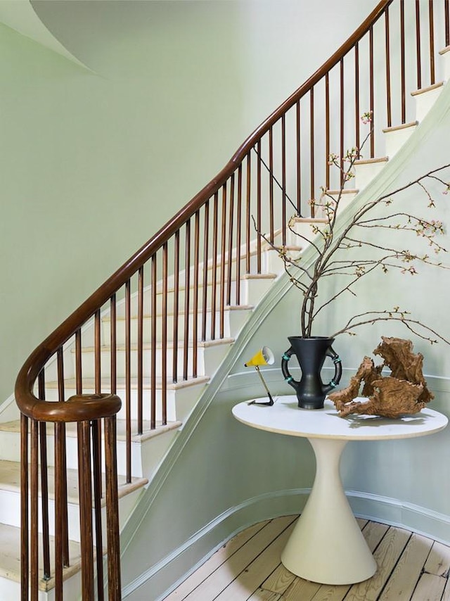 stairway featuring baseboards and wood finished floors