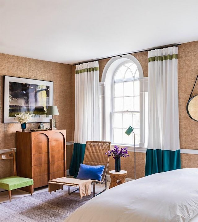 bedroom with wallpapered walls