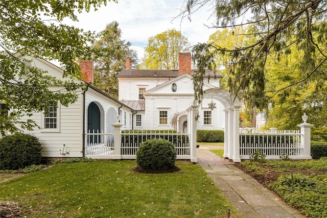 back of property featuring a chimney