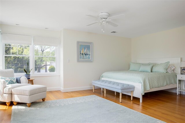 1145 Bay Haven Ln, Southold, NY 11971 - bedroom with baseboards, wood finished floors, and ceiling fan