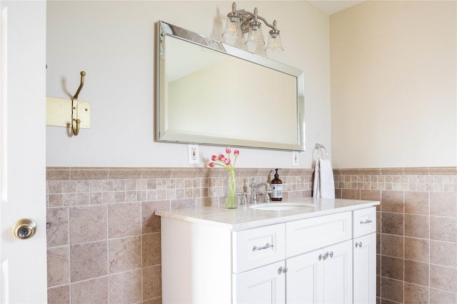1145 Bay Haven Ln, Southold, NY 11971 - bathroom with tile walls, vanity, and a wainscoted wall