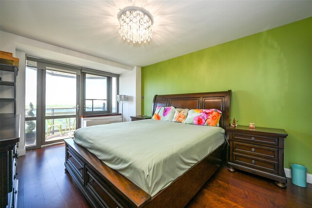 bedroom with a chandelier and access to outside
