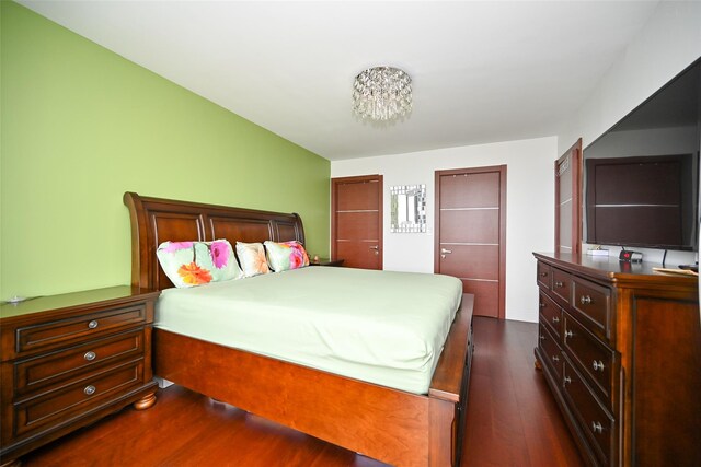 bedroom featuring dark wood-type flooring