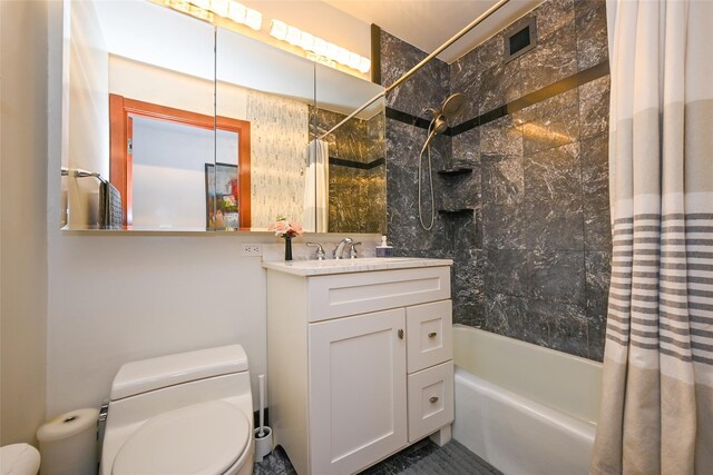 full bathroom featuring toilet, shower / bath combination with curtain, and vanity