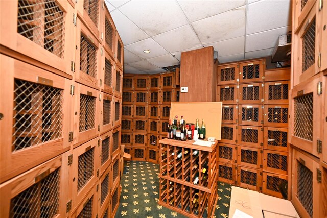 wine cellar with recessed lighting and a paneled ceiling