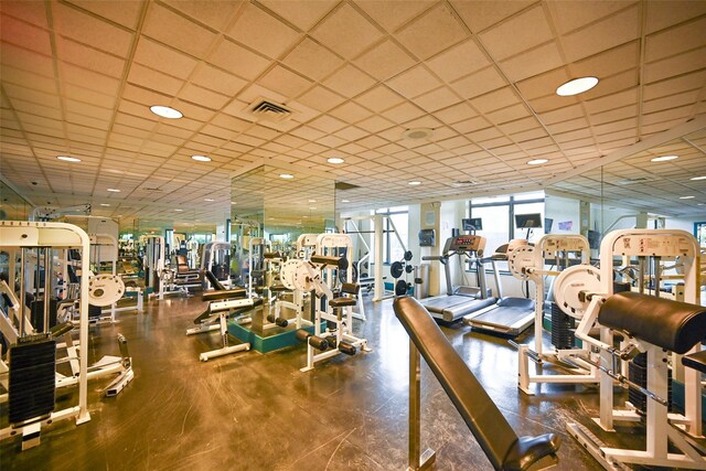 workout area featuring a paneled ceiling and recessed lighting