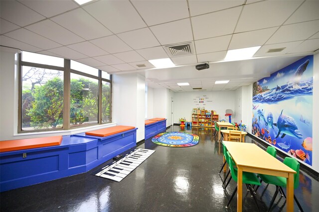 game room featuring a drop ceiling