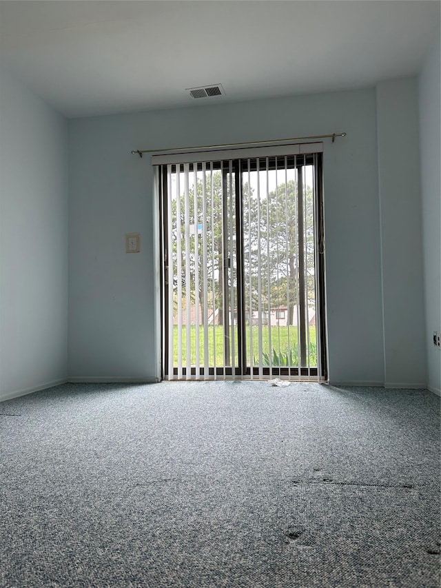 10 Monet Ct Unit 10, Middle Island, NY 11953 - empty room featuring healthy amount of natural light and carpet