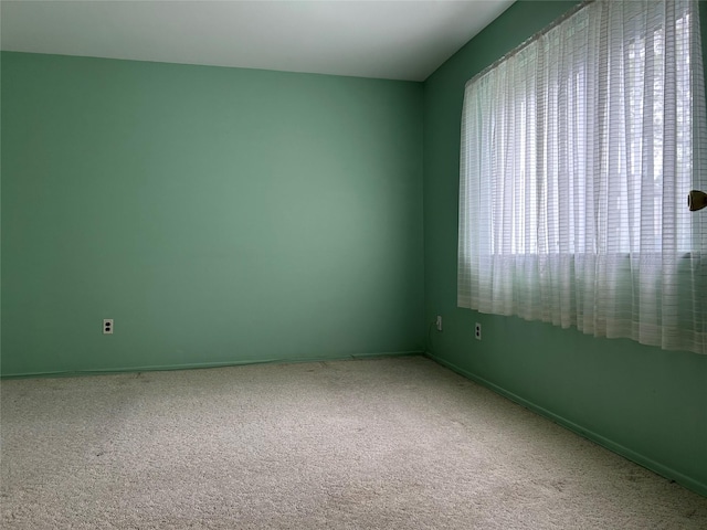 10 Monet Ct Unit 10, Middle Island, NY 11953 - spare room with carpet and baseboards