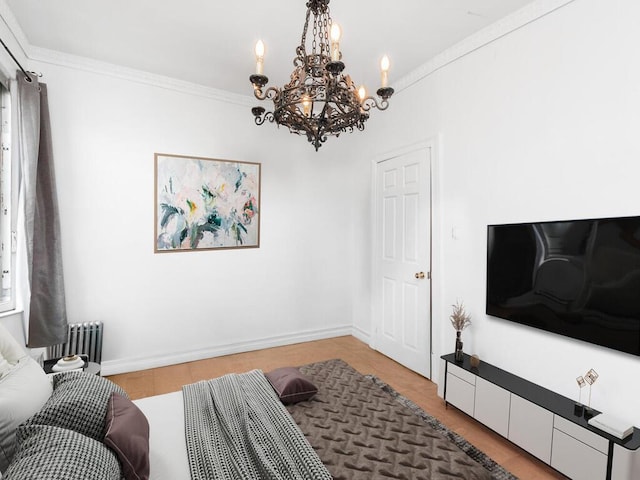 bedroom featuring radiator heating unit, a chandelier, ornamental molding, and baseboards