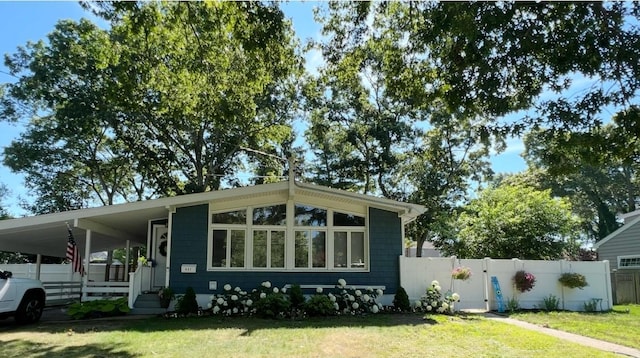 view of front of home featuring a carport