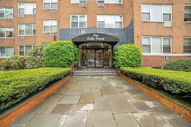 property entrance with brick siding