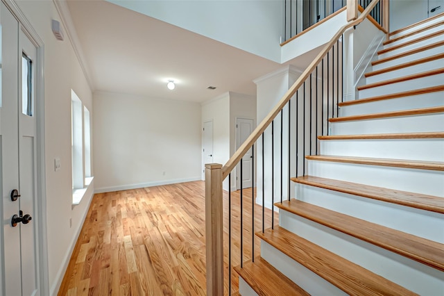 36-A Maple Ave, Port Jefferson Station, NY 11776 - stairway with wood finished floors, baseboards, and crown molding