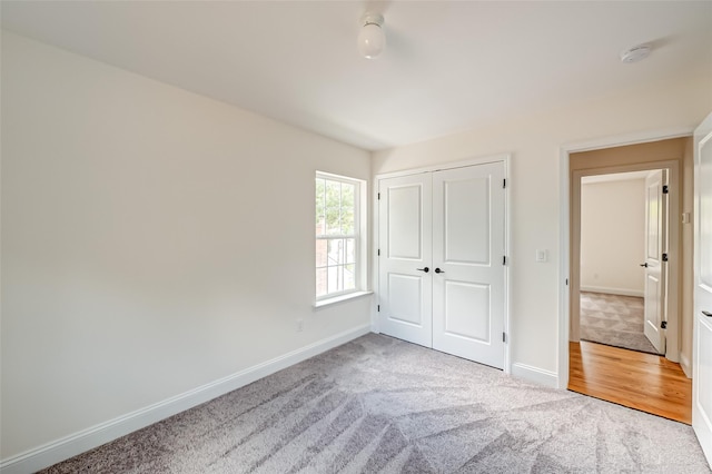 36-A Maple Ave, Port Jefferson Station, NY 11776 - unfurnished bedroom with carpet floors, baseboards, and a closet