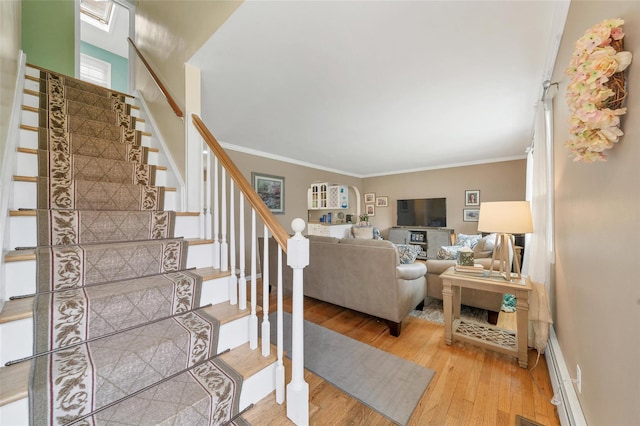 12 Dorothy Dr, Monroe, NY 10950 - stairs featuring hardwood / wood-style floors, crown molding, baseboard heating, and baseboards