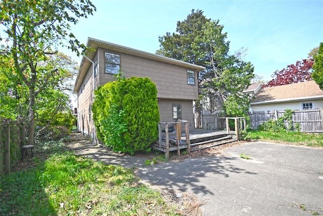 51 Manor Rd, Valley Stream, NY 11580 - back of house featuring fence and a wooden deck