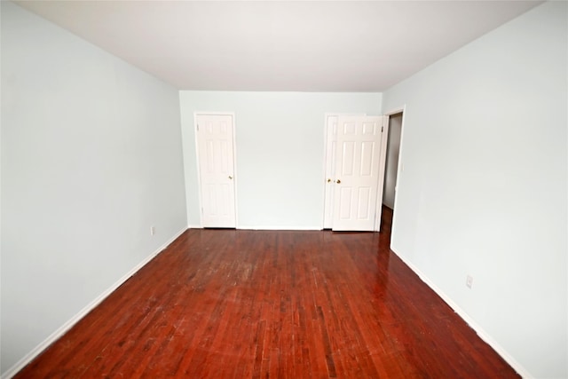 51 Manor Rd, Valley Stream, NY 11580 - unfurnished room featuring wood-type flooring and baseboards