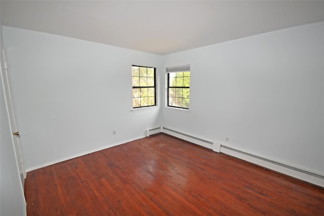 51 Manor Rd, Valley Stream, NY 11580 - unfurnished room featuring wood finished floors, a baseboard radiator, and baseboards
