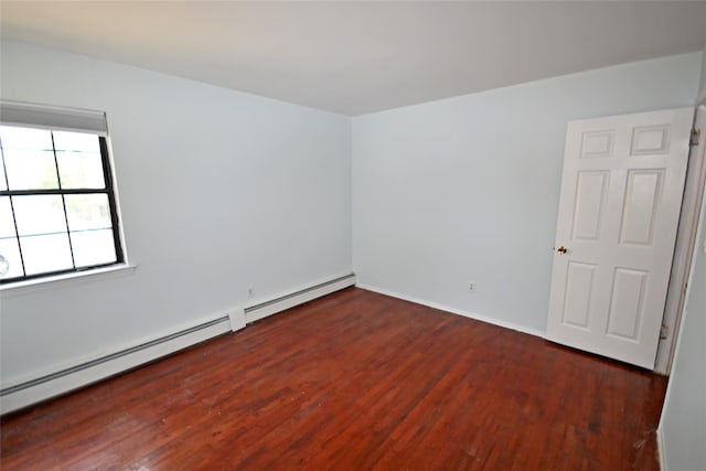51 Manor Rd, Valley Stream, NY 11580 - unfurnished room featuring a baseboard radiator, wood finished floors, and baseboards