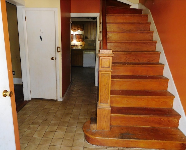 staircase with tile patterned flooring