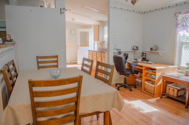 15 Feller Newmark Rd, Red Hook, NY 12571 - dining area with light wood-style flooring, a baseboard radiator, an office area, and vaulted ceiling