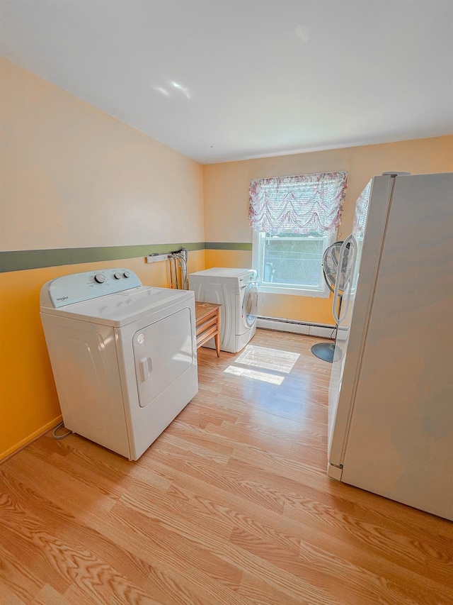 15 Feller Newmark Rd, Red Hook, NY 12571 - laundry area with washer / dryer, light wood-style floors, and a baseboard heating unit