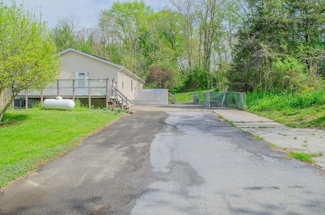 15 Feller Newmark Rd, Red Hook, NY 12571 - view of asphalt driveway with a gate
