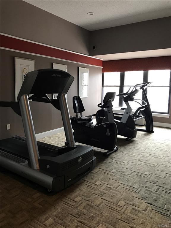 100 New Roc City Pl Unit 408, New Rochelle, NY 10801 - gym with carpet and a textured ceiling