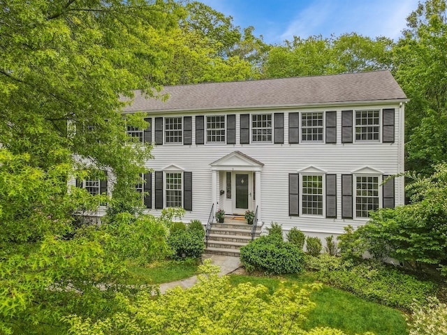 16 Cayuga Rd, Scarsdale, NY 10583 - colonial inspired home featuring roof with shingles