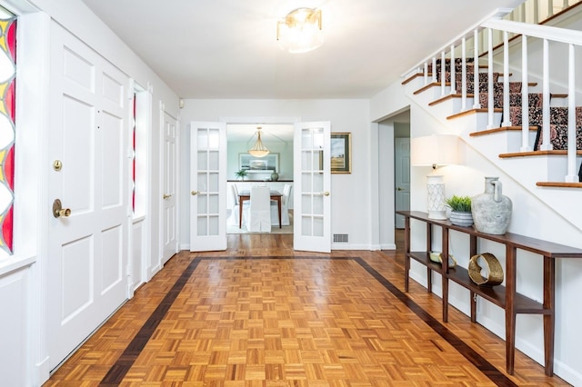 16 Cayuga Rd, Scarsdale, NY 10583 - entrance foyer featuring french doors, stairway, and baseboards