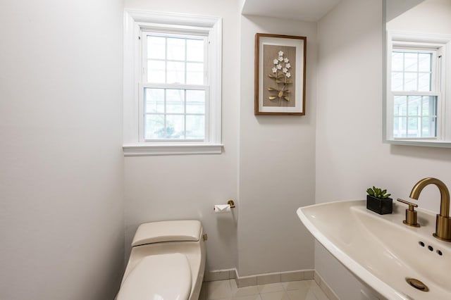 16 Cayuga Rd, Scarsdale, NY 10583 - half bath featuring toilet, baseboards, a sink, and tile patterned flooring