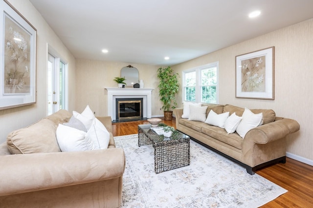 16 Cayuga Rd, Scarsdale, NY 10583 - living area with wood finished floors, a glass covered fireplace, baseboards, and recessed lighting