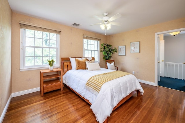 16 Cayuga Rd, Scarsdale, NY 10583 - bedroom featuring wood finished floors, multiple windows, baseboards, and a ceiling fan
