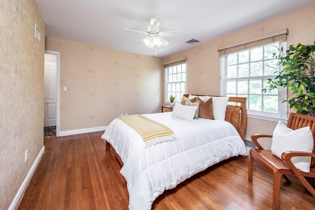 16 Cayuga Rd, Scarsdale, NY 10583 - bedroom with wood finished floors, multiple windows, and baseboards
