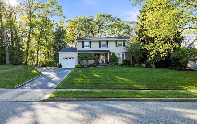 90 Gannet Dr, Commack, NY 11725 - view of front of property featuring an attached garage, driveway, a porch, and a front lawn