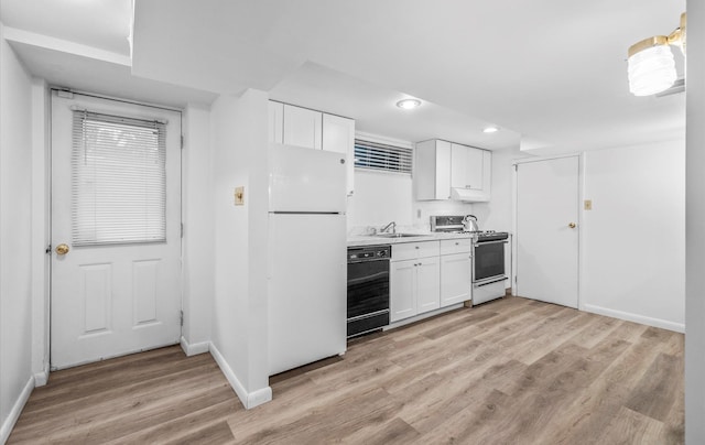 90 Gannet Dr, Commack, NY 11725 - kitchen with range with gas stovetop, dishwasher, freestanding refrigerator, a sink, and light wood-style flooring