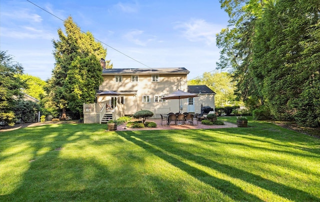 90 Gannet Dr, Commack, NY 11725 - rear view of property with a wooden deck, a yard, a patio, and a chimney